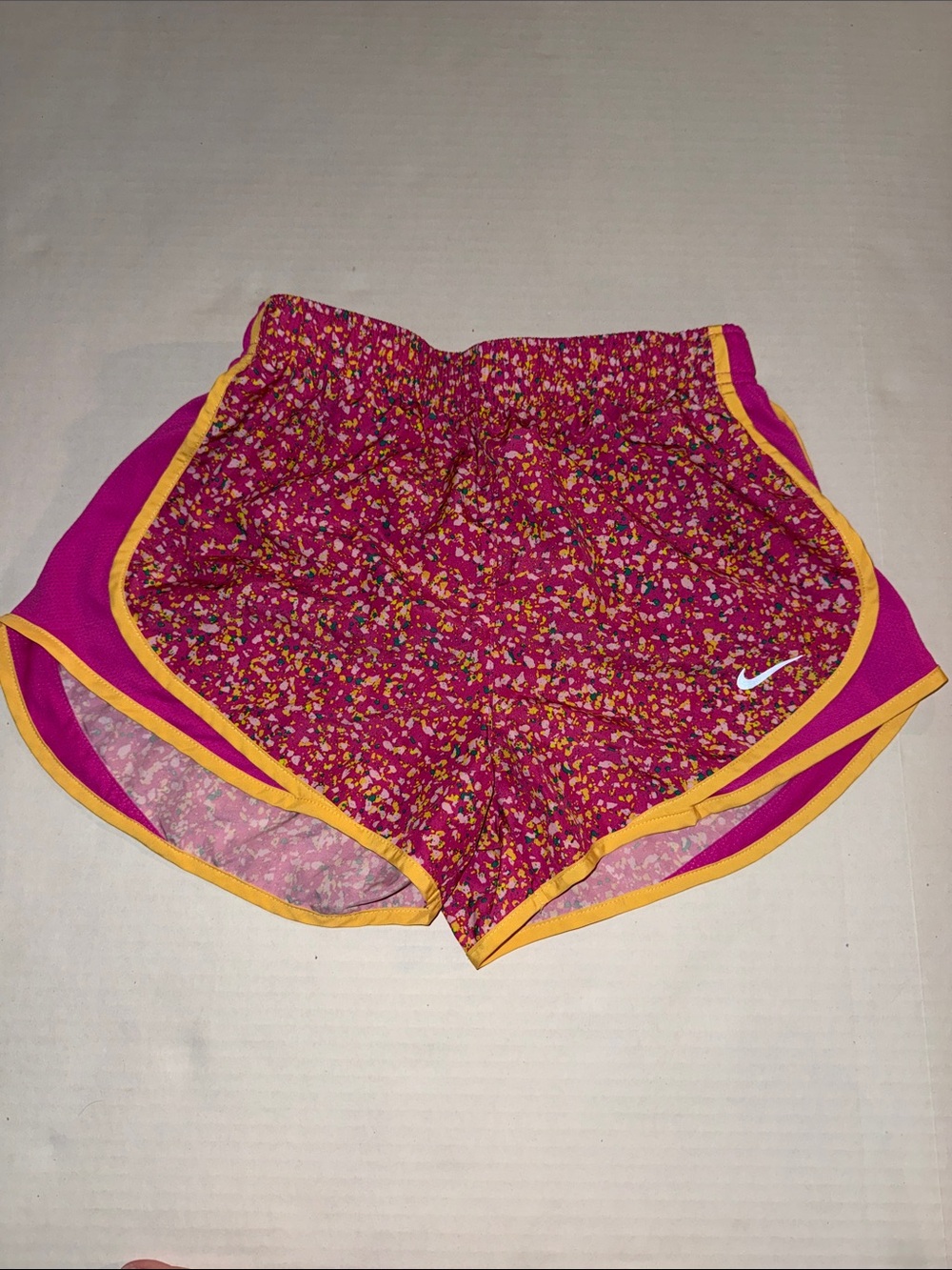 Nike Women's Pink Floral Athletic Shorts with Yellow Trim